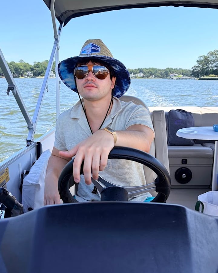 Francis driving a boat